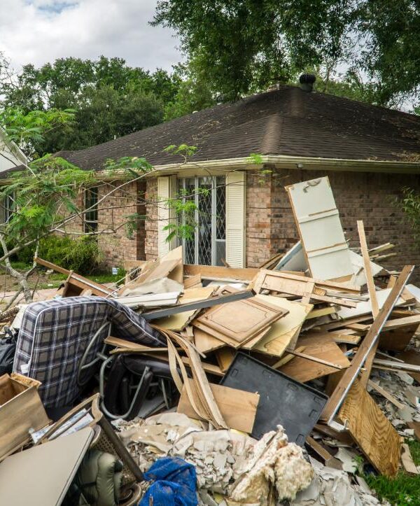 Buford-GA-911-Junk Flooded Living Room with White Sofa